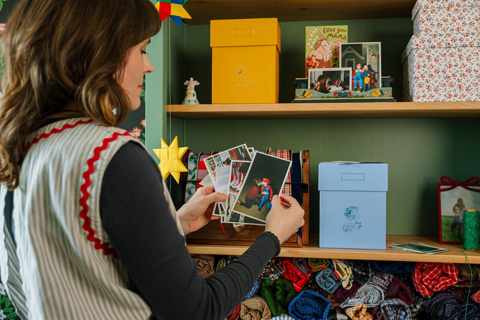 Person looking at the printed photos